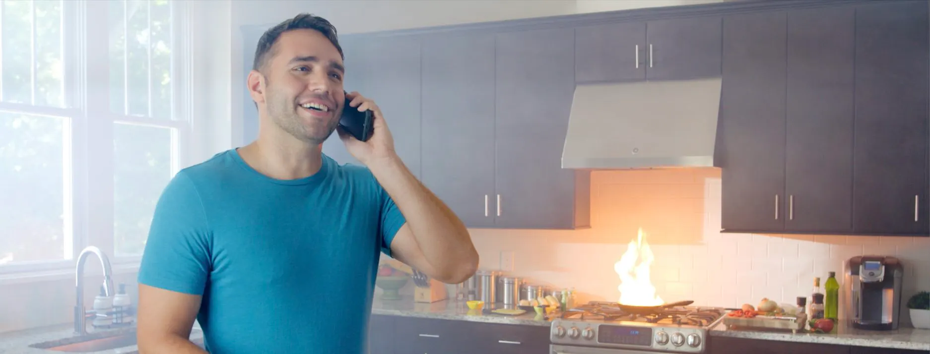 Bascom Advisors brand strategy and creative campaign by nez&pez, featuring a man on the phone oblivious to a kitchen fire, illustrating the financial advisory firm's borrower-first positioning: Your Interest Above All.
